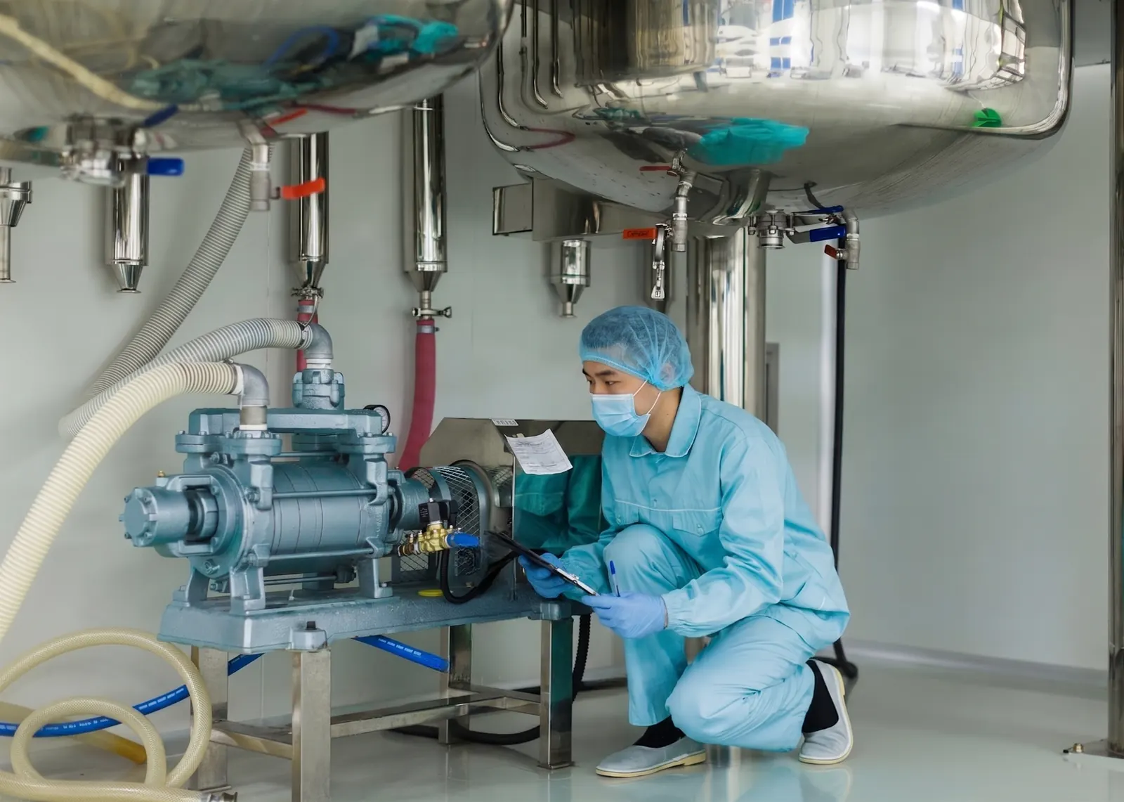 Technician inspecting a compressed dry air pump system